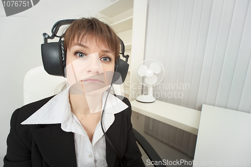 Image of Ridiculous woman dressed on head big ear-phones