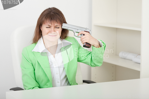 Image of Young woman commits suicide on workplace at office