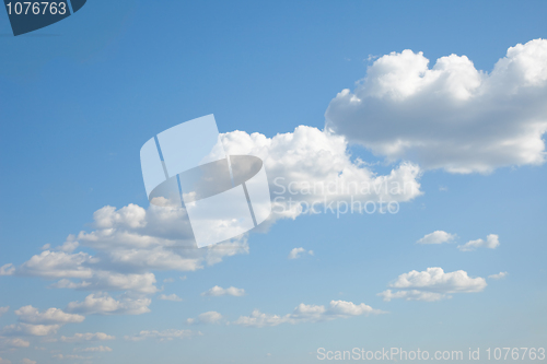Image of Blue sky with cumulus clouds built abreast
