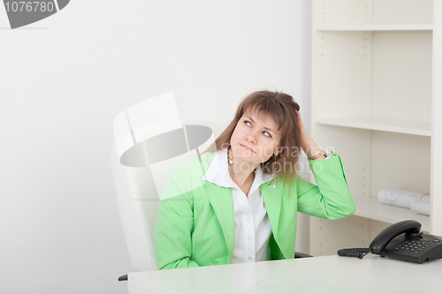Image of Beautiful girl at office on workplace