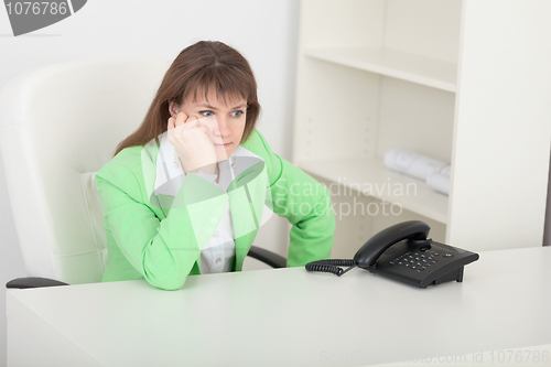 Image of Young beautiful woman at office on workplace