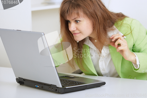 Image of Girl is angry with the laptop and Internet