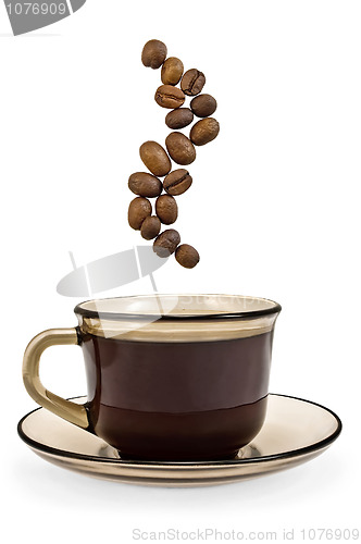 Image of Brown cup of coffee and steam from the grains