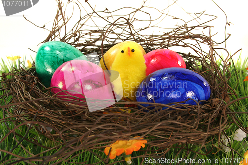 Image of Easter basket with Easter eggs and chicks