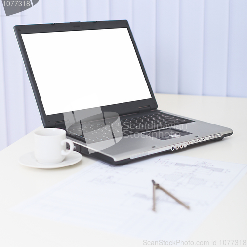 Image of Business still-life - laptop on a table at office