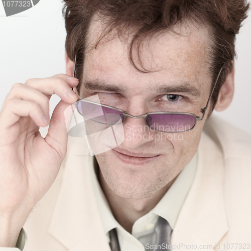 Image of Amusing portrait of artful man with spectacles close up