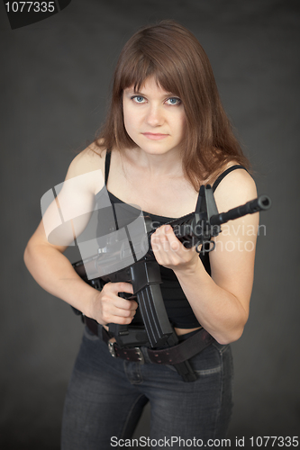 Image of Woman - fighter of special troops with a rifle in hands