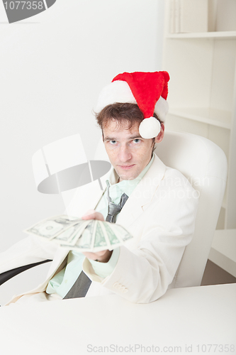 Image of People in Christmas hat gives us money