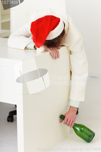 Image of Drunk businessman during celebrating of new year