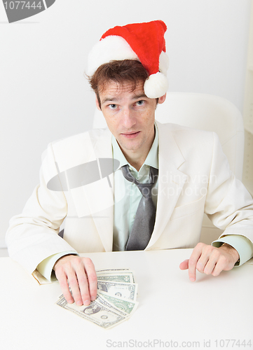 Image of Young businessman has received new year s premium