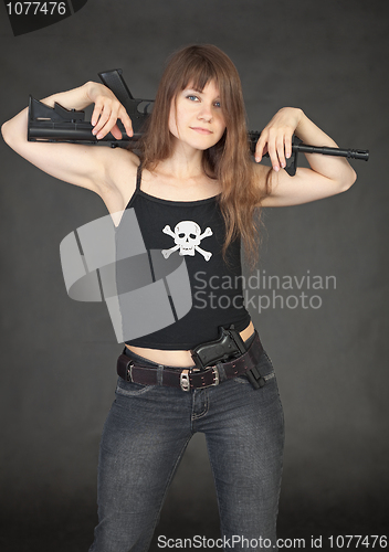 Image of Modern pirate of female with rifle on black background