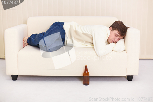 Image of People comfortable sleeps on sofa having got drunk beer