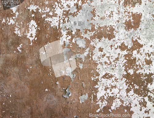 Image of Concrete wall covered cracked paint and dirt