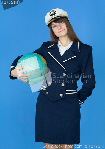 Image of Woman in sea uniform with globe