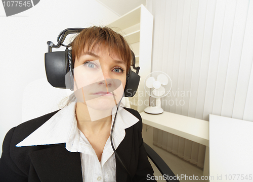 Image of Comical girl in big stereos ear-phones