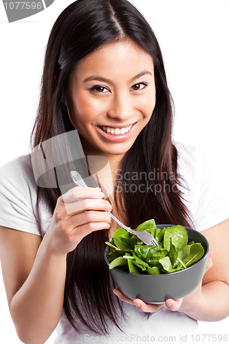 Image of Asian woman eating salad