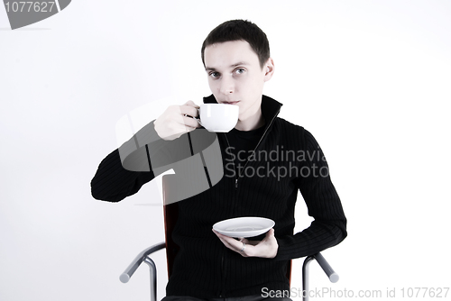 Image of young man with a cup of tea 