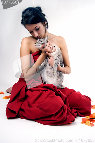 Image of pretty woman with cat    