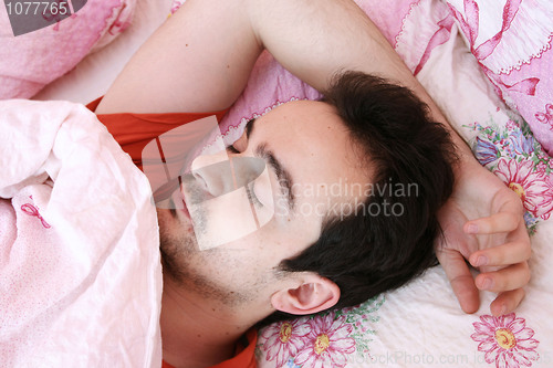 Image of Young man sleeping .
