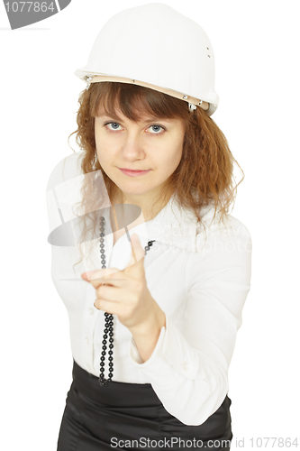Image of Young beautiful woman engineer in helmet on white