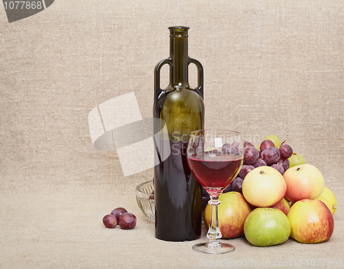 Image of Bottle, glass and fruit on canvas - still-life