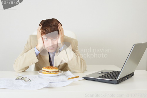Image of Young man was going to eat sandwich