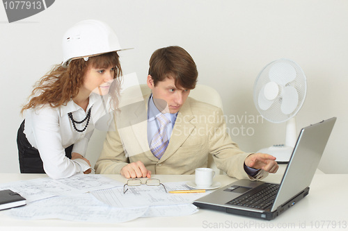 Image of Young experts are occupied by work at office