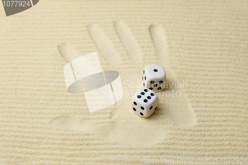 Image of Print of a palm with dices lying on it