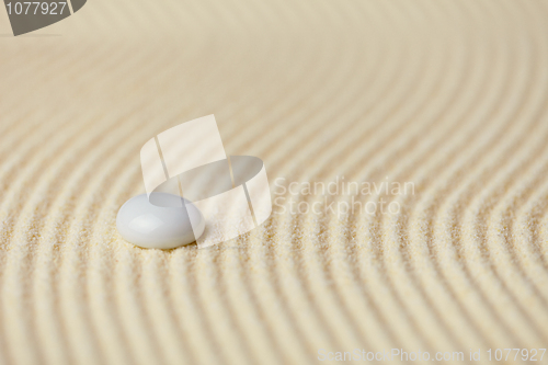 Image of Abstract background of sand with white glass stone