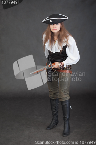 Image of Woman in a costume of sea pirate on black background
