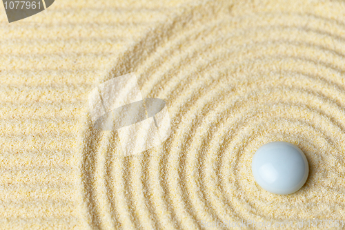 Image of White drop on surface of yellow sand - abstract background