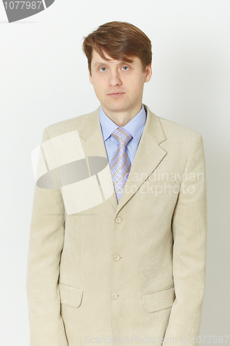 Image of Young man in light jacket - front view