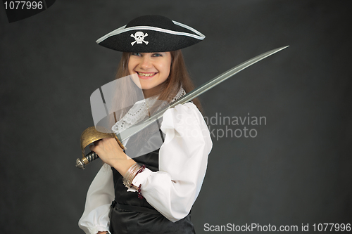 Image of Laughing pirate in hat armed with sabre