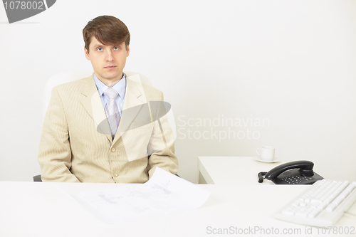 Image of Serious businessman attentively listens
