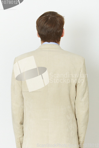 Image of Young man in light jacket - rear view