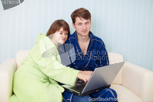 Image of Couple on sofa with laptop
