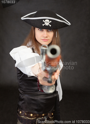 Image of Woman - pirate aims in us from an ancient pistol