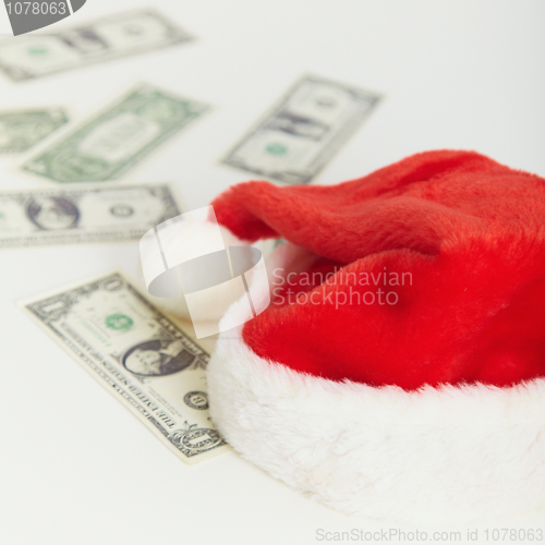 Image of Christmas cap and the scattered money