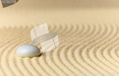 Image of Sandy yellow background and glass stone - abstract composition