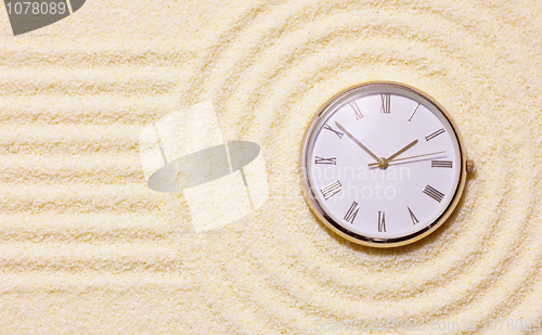 Image of Old watch on sand in composition of Japanese rock-garden