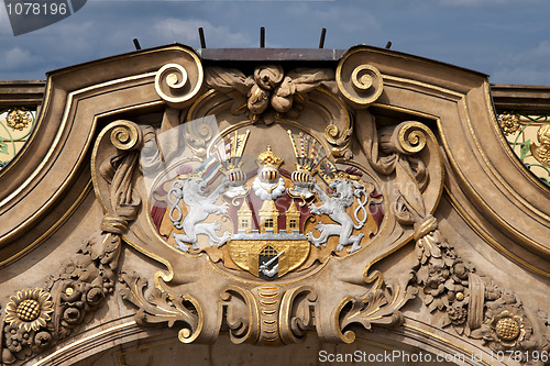 Image of Prague's Coat of Arms proudly displayed on the facade of a mansion.