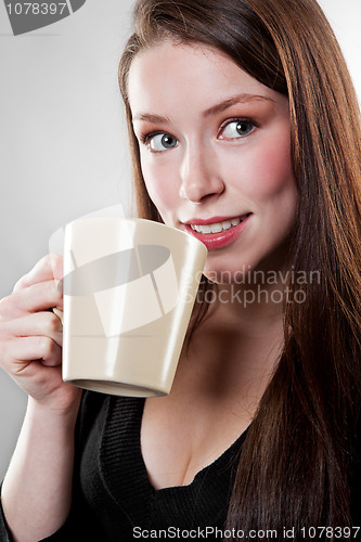 Image of Businesswoman drinking coffee