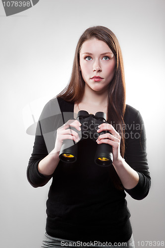 Image of Businesswoman with binoculars