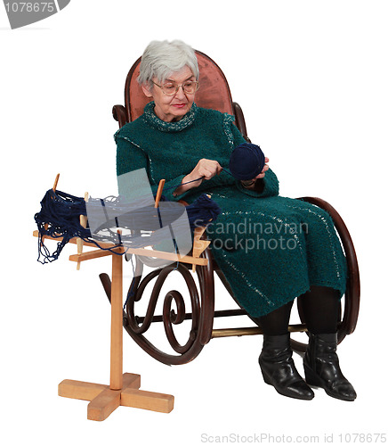 Image of Old woman using a reel