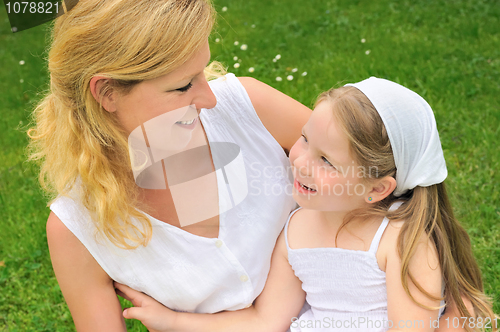 Image of Portrait of young woman and her daughter - happy time