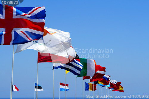 Image of Flags of the EU against blue sky