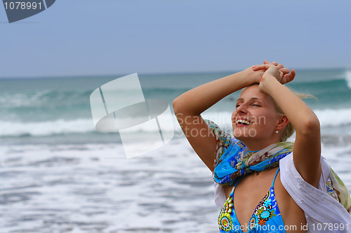 Image of Young beautiful woman on the beach 