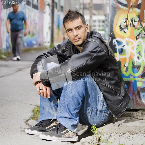 Image of man in graffiti background