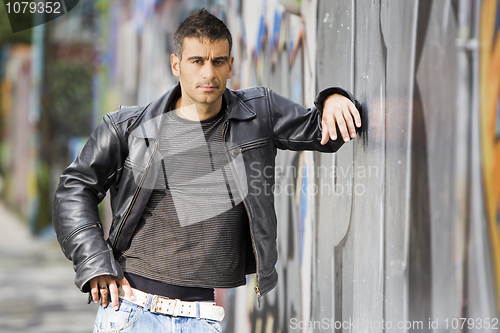 Image of man in graffiti background