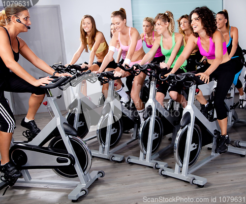 Image of Group of people doing exercise on a bike